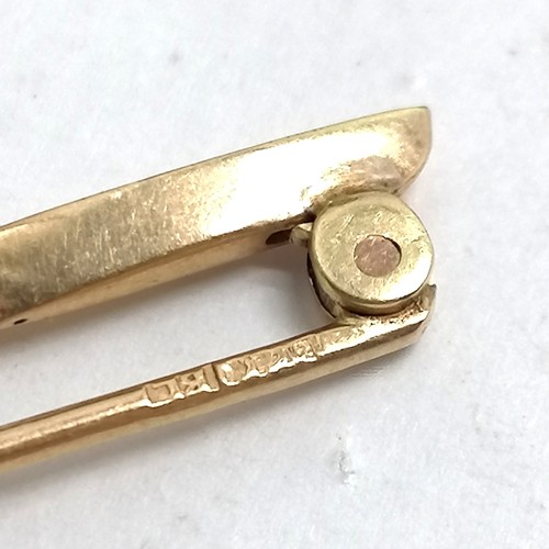 555 - Antique indistinctly marked (18ct) gold bar brooch set with 3 diamonds - 4cm & 2.4g total weight