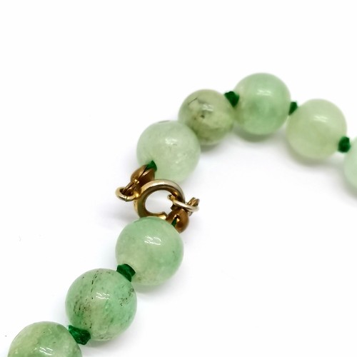 608 - Strand of jadeite beads - 56cm long