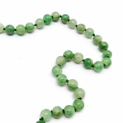 608 - Strand of jadeite beads - 56cm long