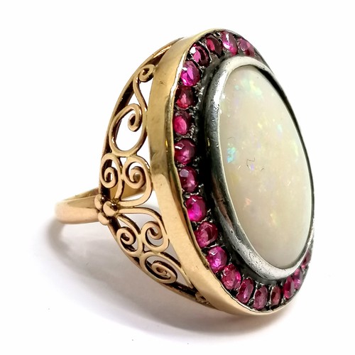 619 - Unmarked gold large opal & ruby (?) cluster ring - size M½+ & 10.5g total weight ~ head of ring 2.9c... 