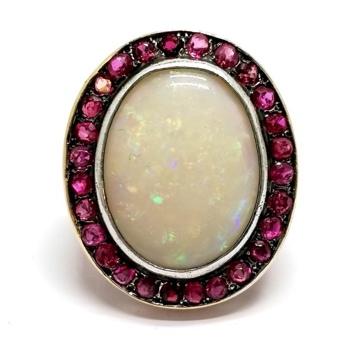 619 - Unmarked gold large opal & ruby (?) cluster ring - size M½+ & 10.5g total weight ~ head of ring 2.9c... 