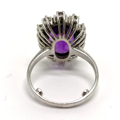 623 - 18ct hallmarked white gold (part mark) unusual amethyst & diamond cluster ring - size K+ & 5.8g tota... 