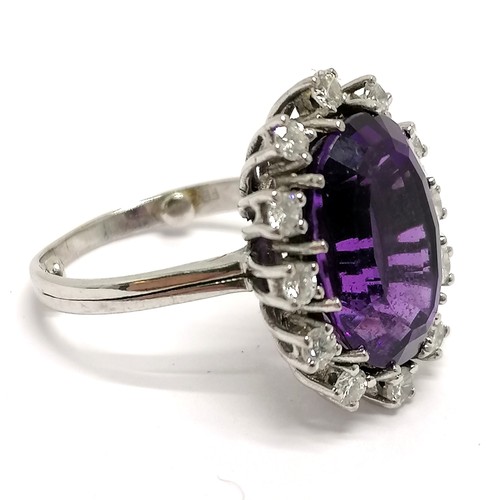 623 - 18ct hallmarked white gold (part mark) unusual amethyst & diamond cluster ring - size K+ & 5.8g tota... 