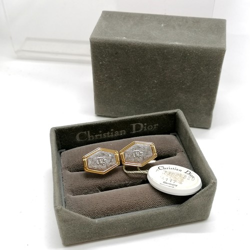 651 - Christian Dior boxed pair of gold / silver tone cufflinks with original swing tag