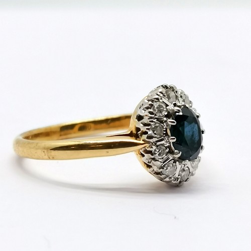 670 - 18ct marked gold & platinum sapphire & diamond oval cluster ring - size N & 3.2g total weight