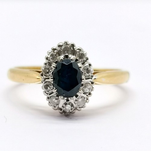 670 - 18ct marked gold & platinum sapphire & diamond oval cluster ring - size N & 3.2g total weight