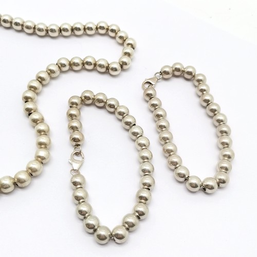 680 - Silver hallmarked bead 40cm necklace & pair of bracelets - total weight (3) 42g