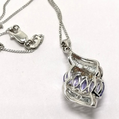 697 - 9ct hallmarked white gold tanzanite & diamond (8) & white stone set pendant on a 9ct hallmarked whit... 