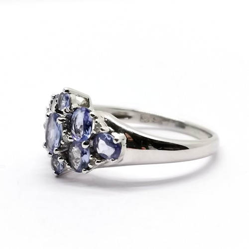 699 - 9ct hallmarked white gold tanzanite (9) & diamond (6) set ring - size O & 2.8g total weight