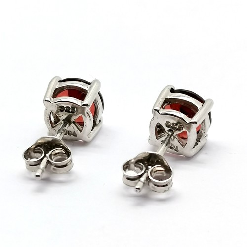 701 - Silver garnet set stud earrings