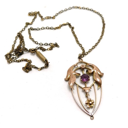 773 - 9ct marked gold Art Nouveau pendant on a 50cm gilt metal chain - total weight 2.9g