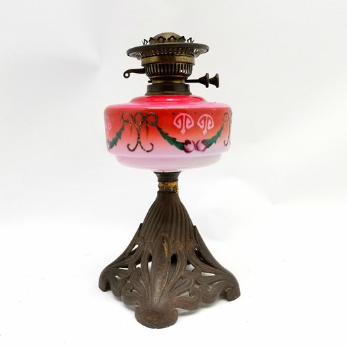 234 - Antique Art Nouveau oil lamp with cast metal base and coloured glass font and original funnel shade ... 