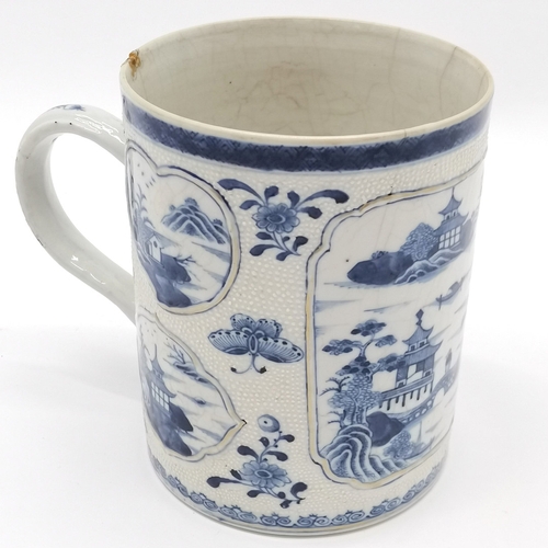 259 - Antique Chinese blue & white tankard with panelled detail - 14cm high x 11cm diameter. - chip to rim... 