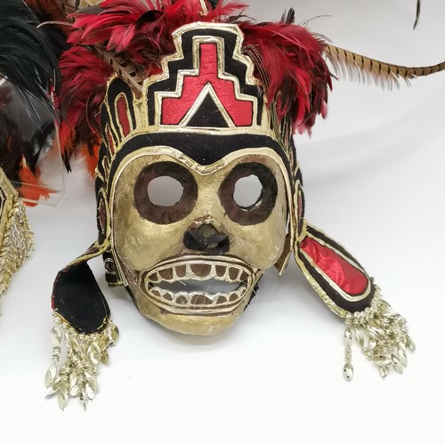 282 - 2 x Mexican Day Of The Dead masks decorated with pheasant tail feathers - skeleton 80cm high