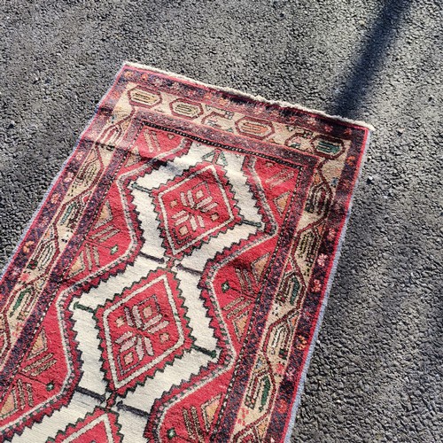 314 - Red grounded runner with diamond detail- 287cm x 81cm