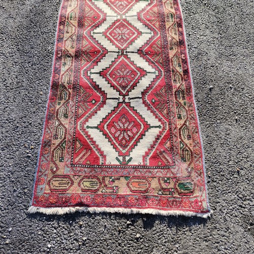 314 - Red grounded runner with diamond detail- 287cm x 81cm