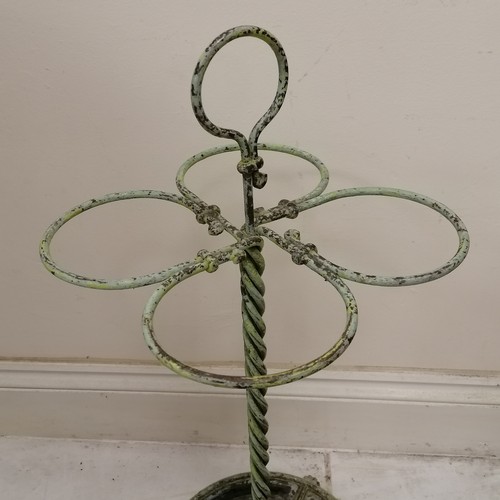 320 - Antique circular green painted cast metal umbrella/stick stand - has losses to the paint otherwise i... 