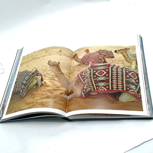 343 - Assouline 'Dubai Wonder' coffee table book 33cm x 25cm.
- has a tear to the inside of the back cover... 