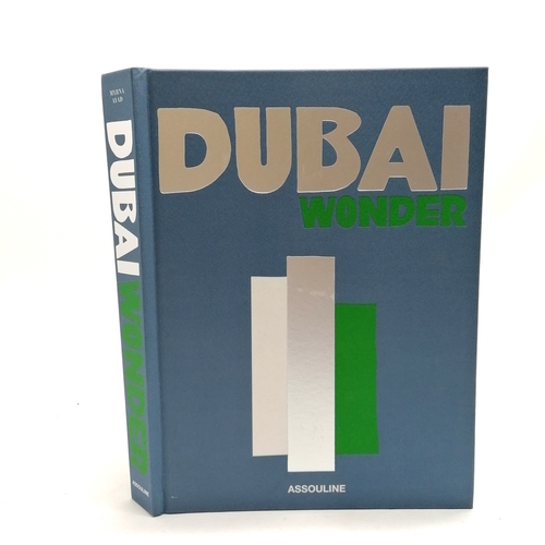 343 - Assouline 'Dubai Wonder' coffee table book 33cm x 25cm.
- has a tear to the inside of the back cover... 