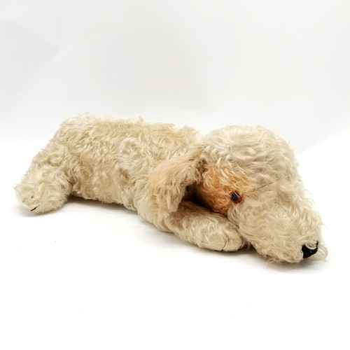 417 - Vintage Merrythought dog pyjama case with glass eyes 56cm long - some wear to the mohair fur