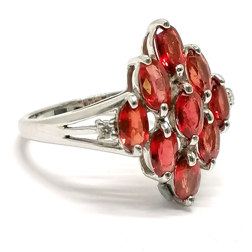 647 - 9ct hallmarked white gold orange stone / diamond cluster ring - size O & 3.3g total weight