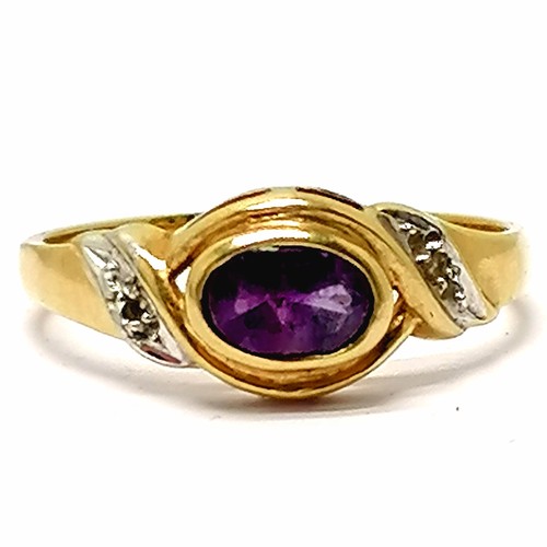 688 - 9ct hallmarked gold amethyst stone set ring with diamond set shoulders - size L & 1.6g total weight