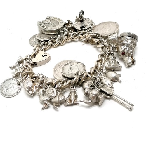 747 - Silver charm bracelet with charms inc fox head pill box, padlock & key fashioned out of QV 3d coins,... 