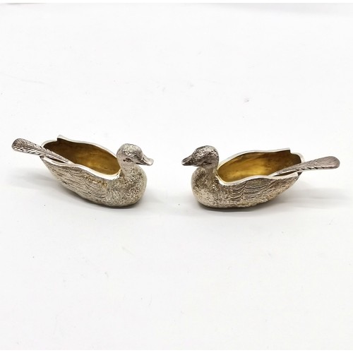 769 - A Haviland-Nye 1972 silver pair of duck salts with original feather detailed spoons and have gilded ... 