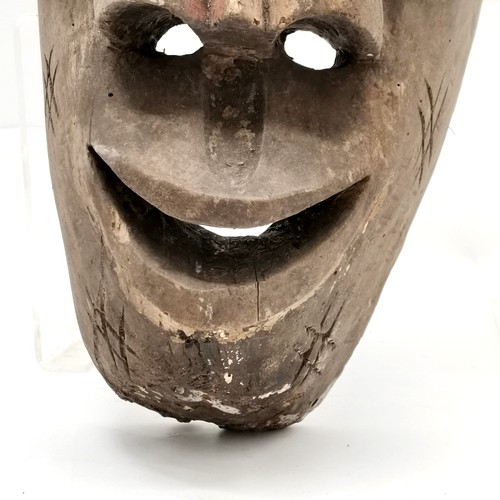 144 - African hand carved tribal mask with original paint detail 46cm X 23cm. s;oight losses