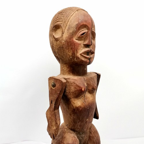 145 - African hand carved wooden ethnic fetish doll with moveable arms 85cm tall & has some losses and shr... 