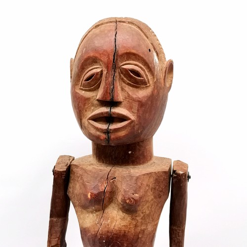 145 - African hand carved wooden ethnic fetish doll with moveable arms 85cm tall & has some losses and shr... 