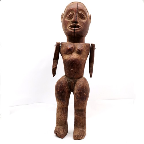 145 - African hand carved wooden ethnic fetish doll with moveable arms 85cm tall & has some losses and shr... 