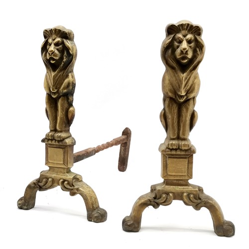 159 - Pair of cast iron and brass lion fire dogs 44cm high x 40cm deep x 20cm wide