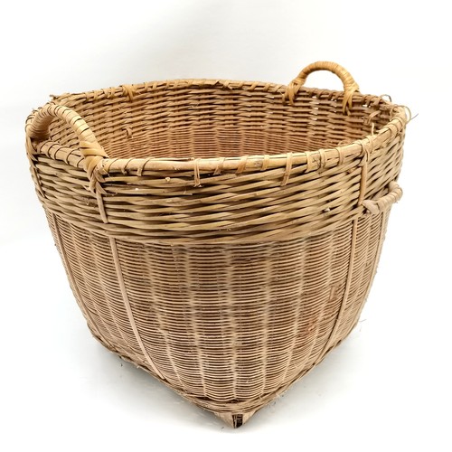 265 - Large wicker 2 handled log basket 57cm diameter x 46cm high - has slight losses