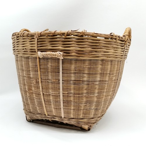 265 - Large wicker 2 handled log basket 57cm diameter x 46cm high - has slight losses