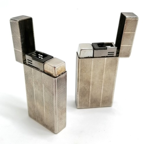 316 - Pair of silver plated Colibri molectric gas lighters - 5.8cm x 3cm & 1 has slightly sprung lid other... 