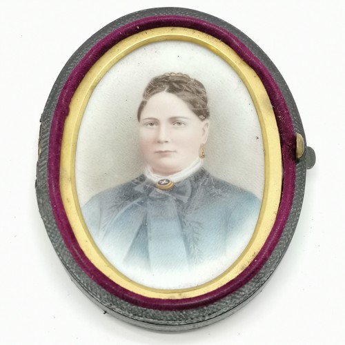 330 - Antique portrait miniature of a lady with plaited hair in original leather case (hinge detached but ... 