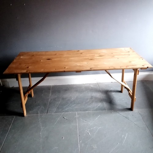 96 - Pine folding trestle table 180cm x 76cm wide
