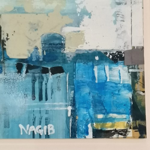 51 - Nagib Karsan (b.1955) original mixed media of a town / city scape - frame 25.5cm x 34.5cm
