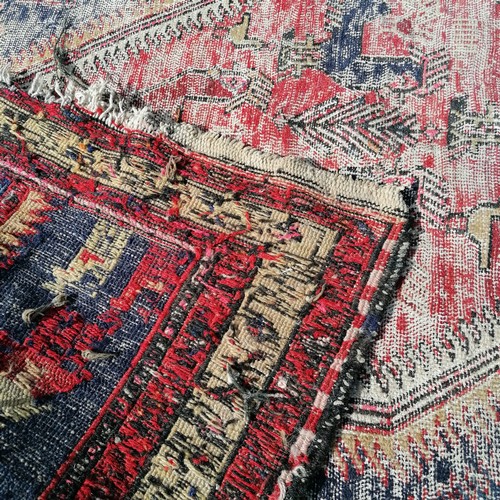 182 - Antique blue grounded wool rug with animal and figural detail 305cm x 115cm  - has obvious wear