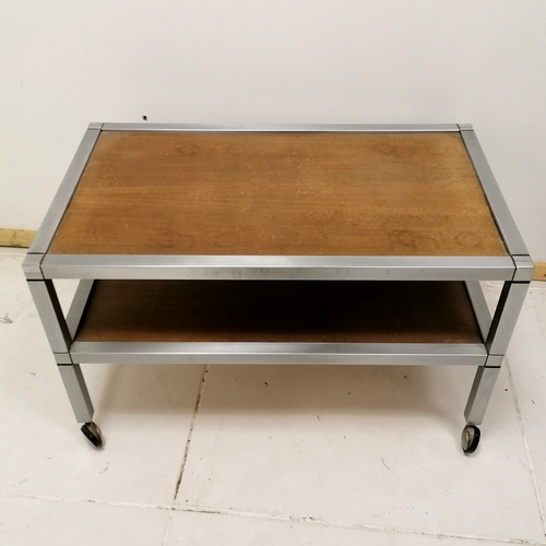 183 - 2 tier teak and chrome low side table on castors - 71.5cm x 41cm x 43cm high