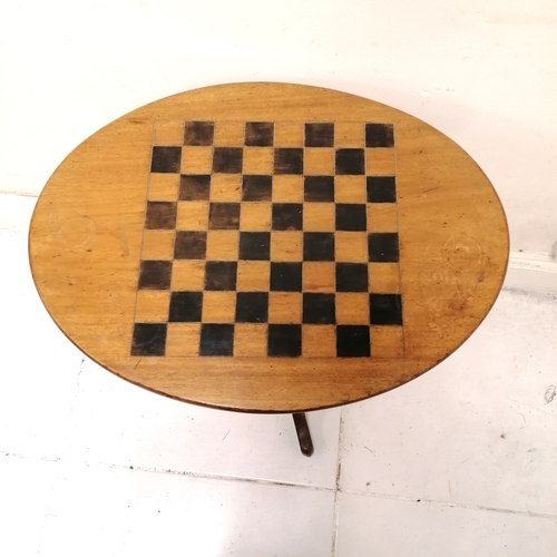 199 - Antique oval mahogany games table on tripod base - 58cm x 43cm x 69cm