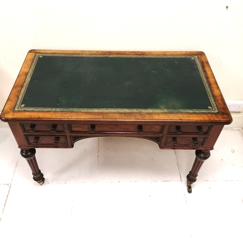 206 - Holland and Sons antique mahogany desk with original green tooled leather top on reeded legs termina... 