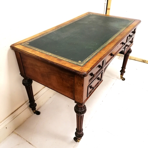 206 - Holland and Sons antique mahogany desk with original green tooled leather top on reeded legs termina... 