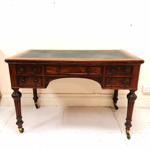 206 - Holland and Sons antique mahogany desk with original green tooled leather top on reeded legs termina... 