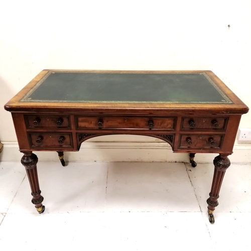 206 - Holland and Sons antique mahogany desk with original green tooled leather top on reeded legs termina... 