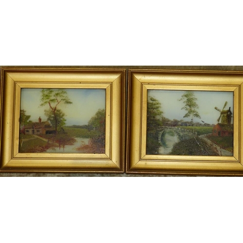 180 - A Pair of Opaline Pictures depicting buildings on river landscapes, in gilt frames, 8cm x 10.5cm