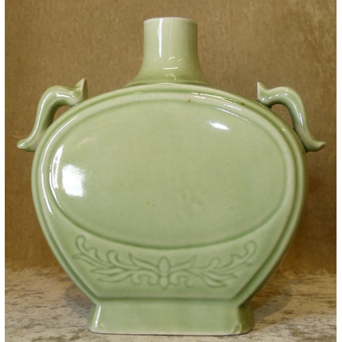 40 - A 20th Century Oriental Green 2-Handled Flask Shape Bottle with label, 17.5cm high