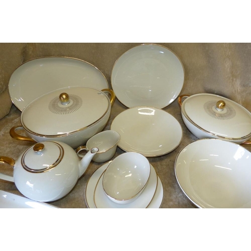 48 - A Hutschenreuther Bavarian Cream China Dinner Service having all over gilt decoration comprising, 2-... 