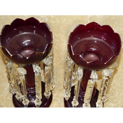 51 - A Pair of Ruby and Clear Glass Lustre Vases having gilt decoration on round sweeping bases (1 base c... 